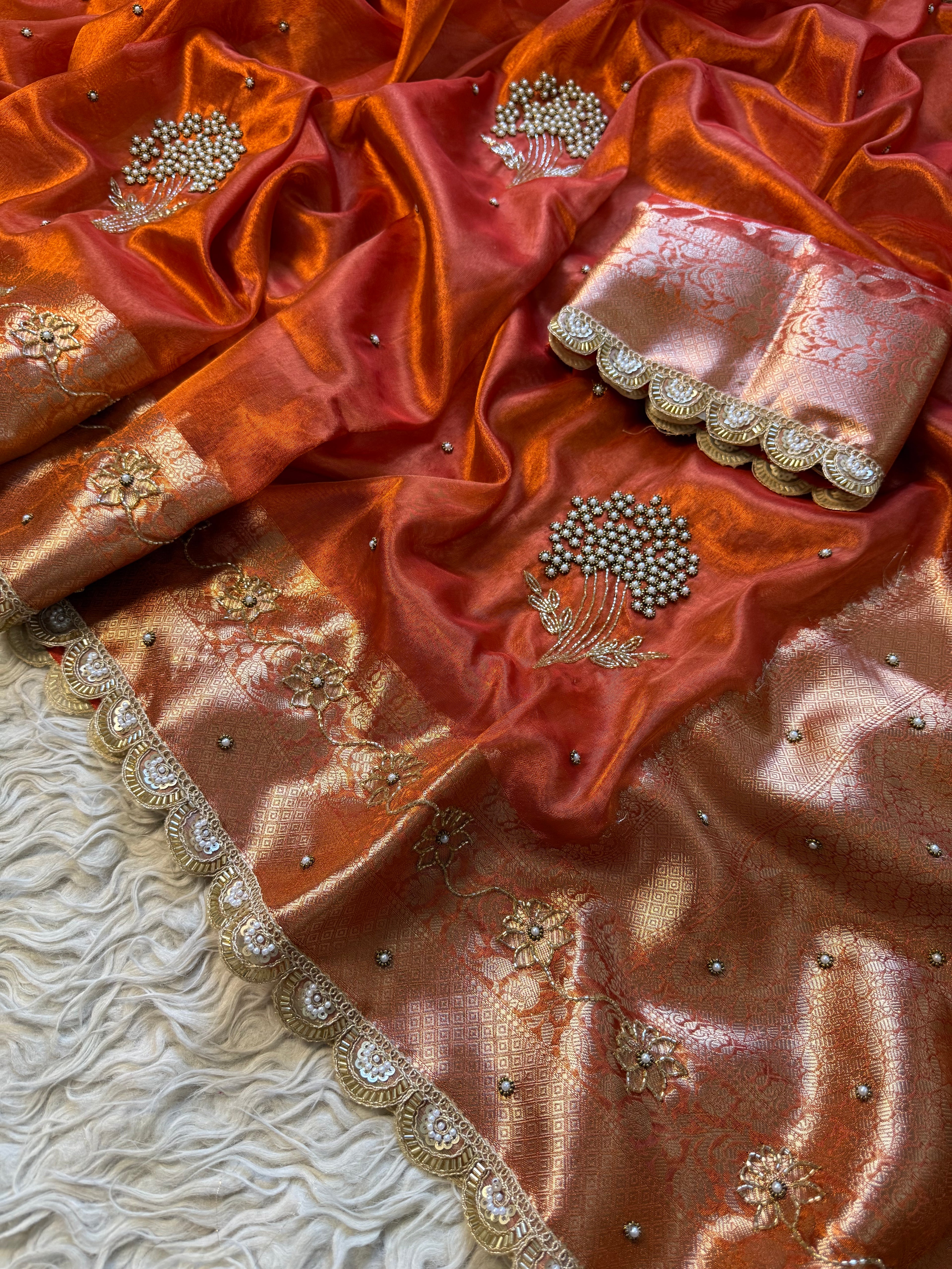 Designer orange pearl and cutdana handwork in buta pattern Tissue Silk Saree