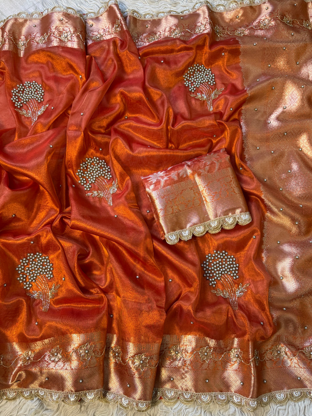 Designer orange pearl and cutdana handwork in buta pattern Tissue Silk Saree