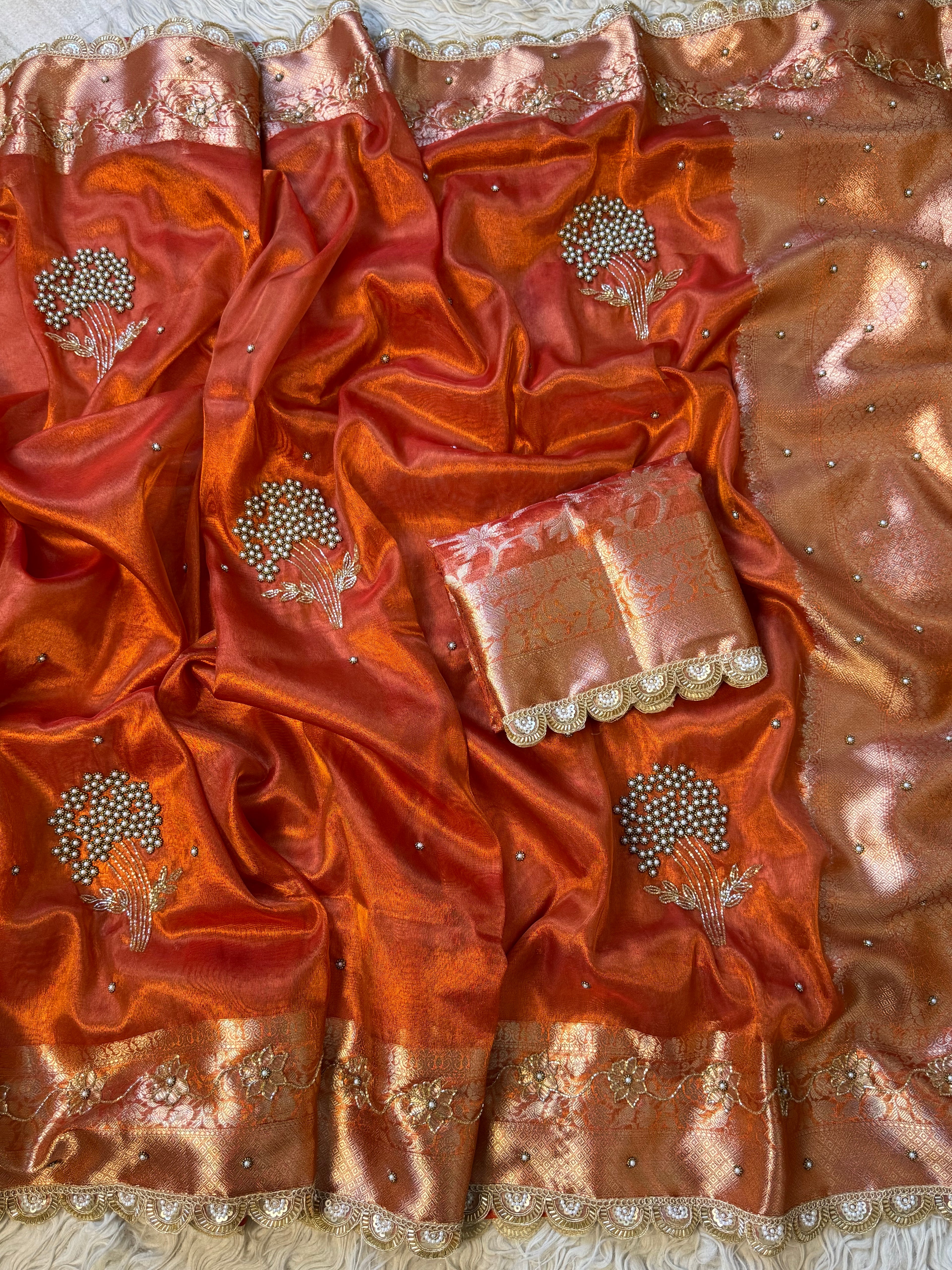 Designer orange pearl and cutdana handwork in buta pattern Tissue Silk Saree