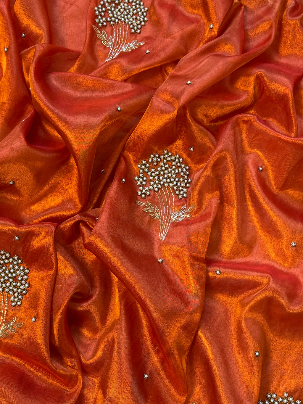 Designer orange pearl and cutdana handwork in buta pattern Tissue Silk Saree
