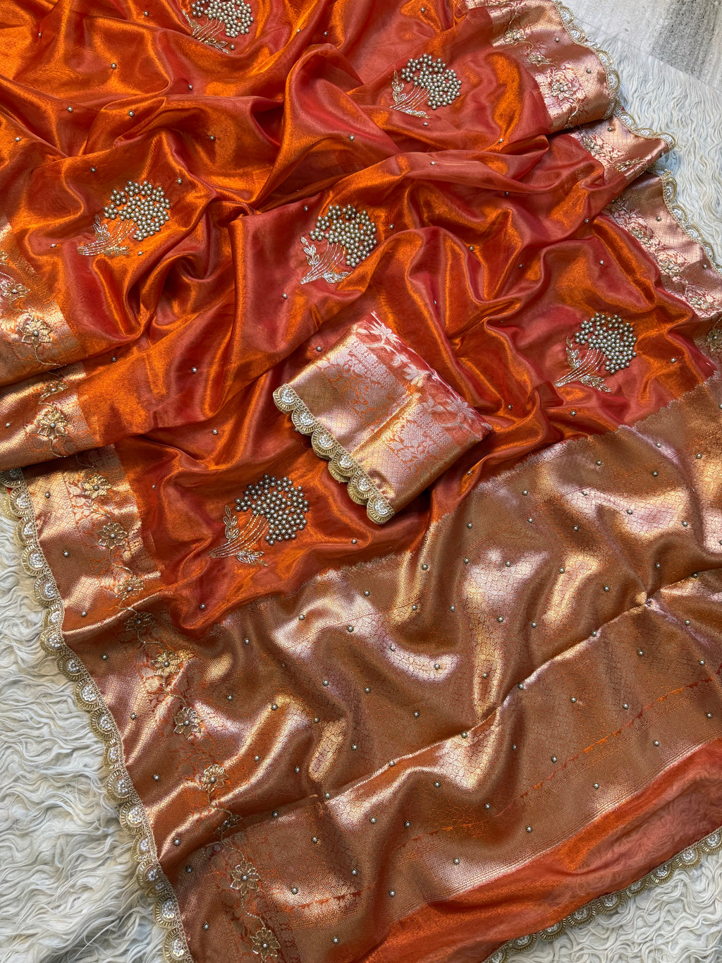 Designer orange pearl and cutdana handwork in buta pattern Tissue Silk Saree